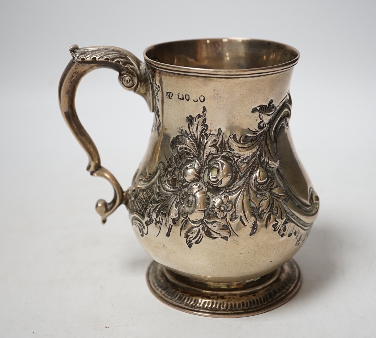 A Victorian embossed silver baluster mug, Charles Boyton II, London, 1866?, height 13cm, 8.6oz.